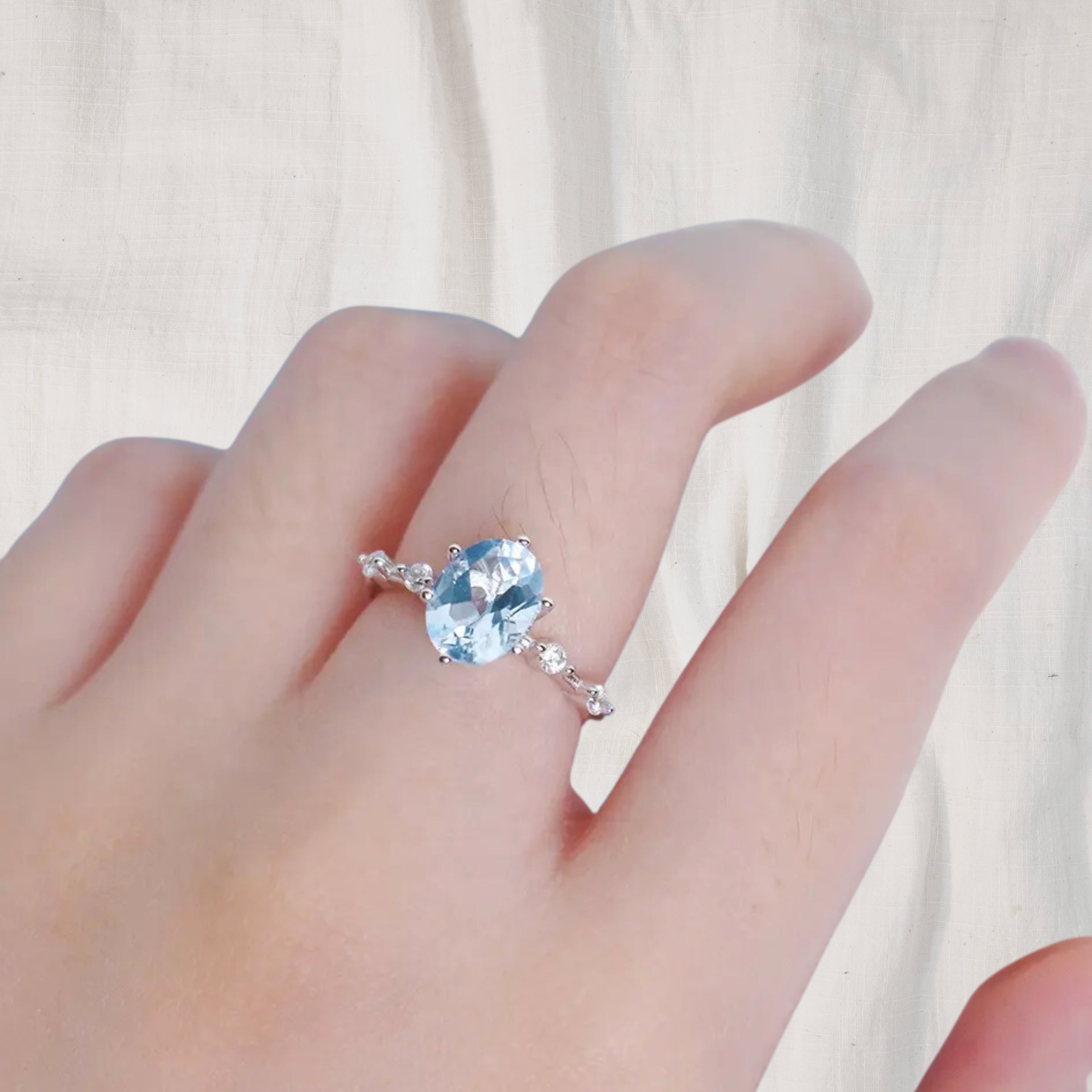 Breathe | Oval Allure Sky Blue Topaz Ring in 18K White Gold - Chakra Energy Co